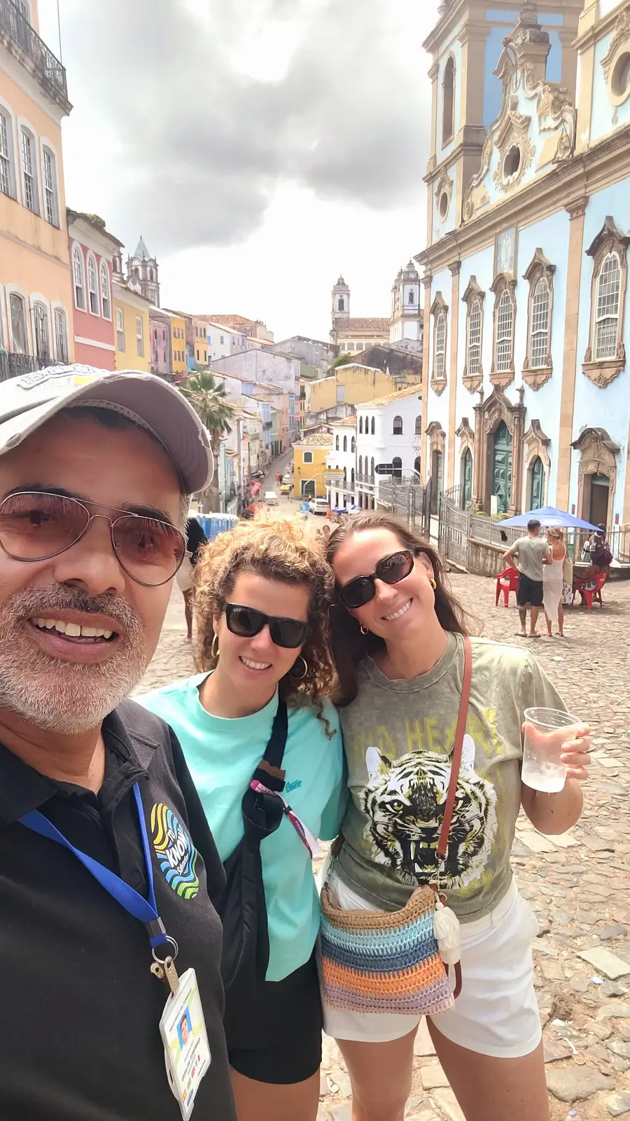Adriano, guide at To Know Salvador, with two travelers in Pelourinho